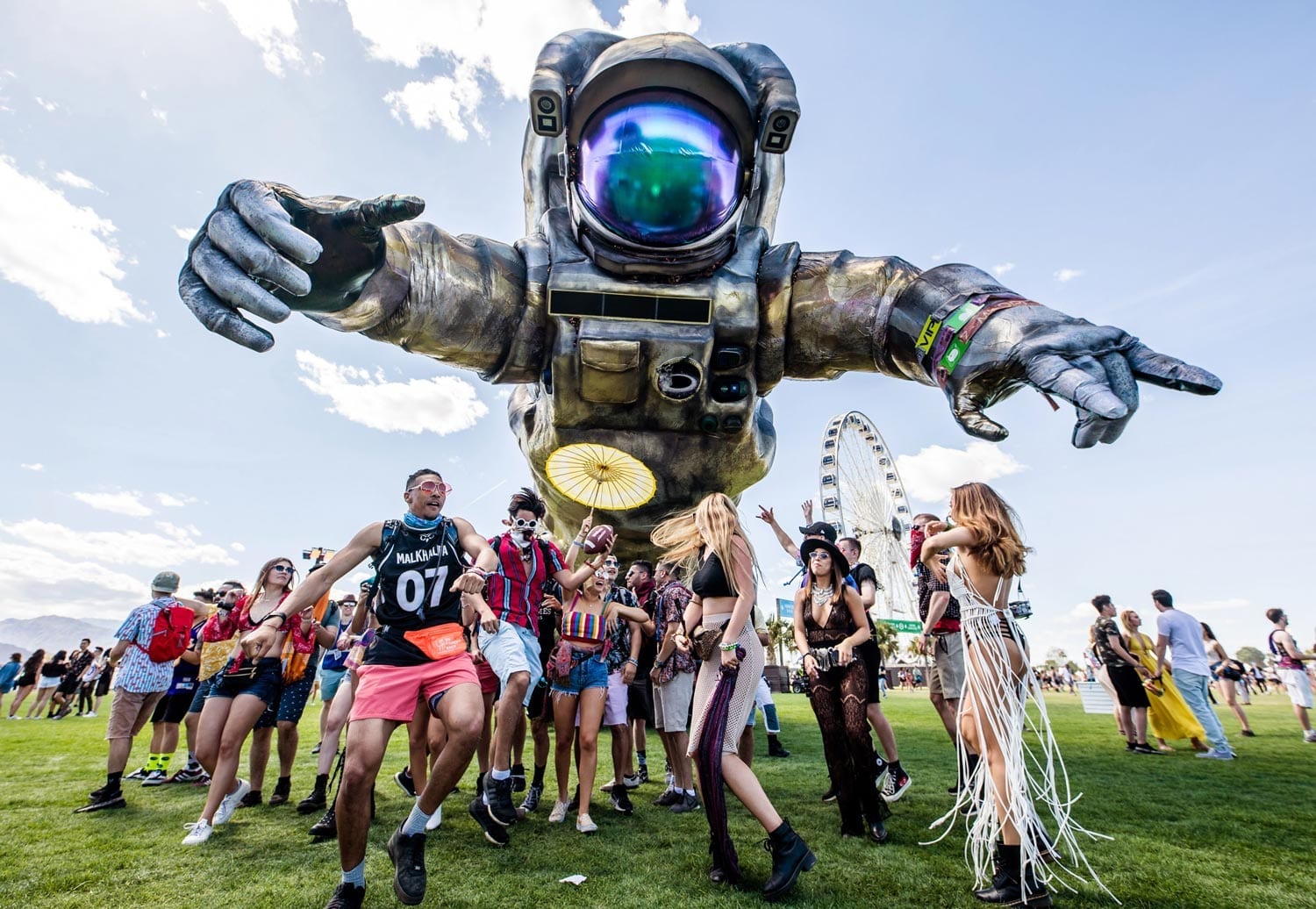 Overview Effect better known as Coachella Astronaut with festivalgoers dancing